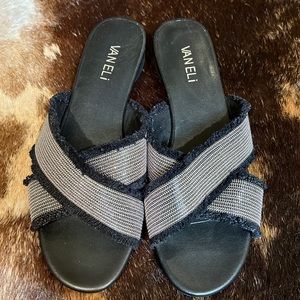 VanEli (Vaneli) flat black frayed and silver metal slip on sandals.